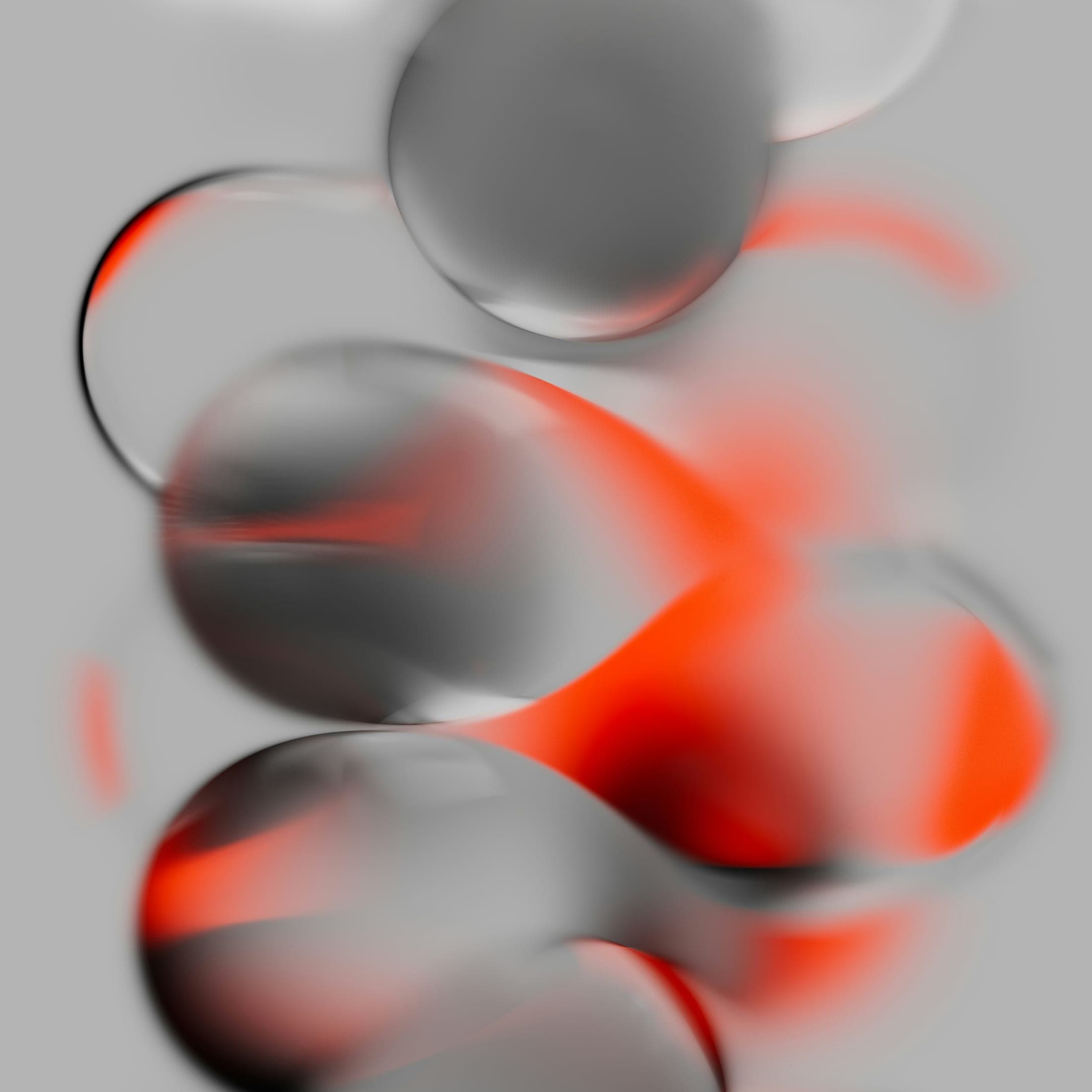 Formes organiques grises traversées de rouge.